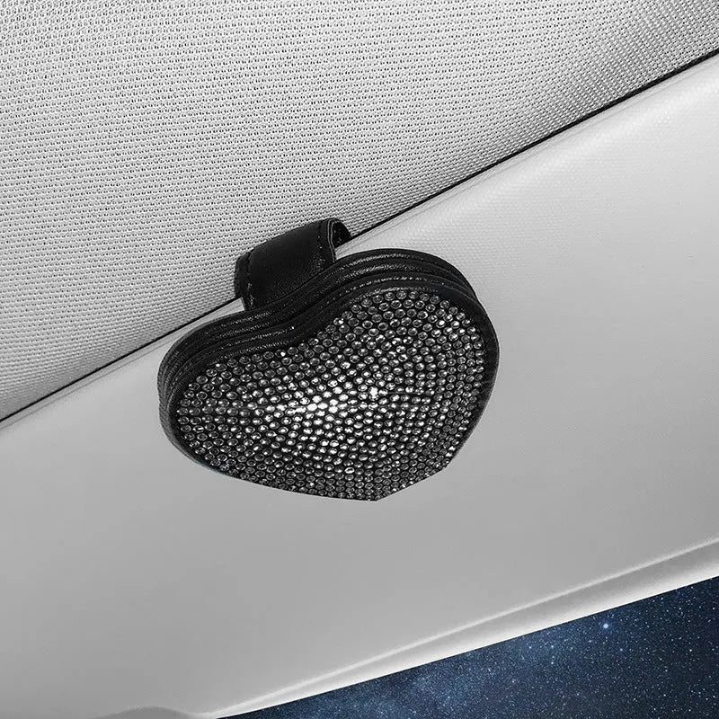 Black PU leather magnetic car sun visor clip holding sunglasses with a slot for tickets.