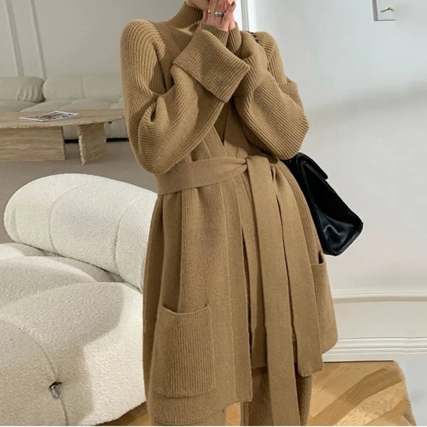 Women's apricot knitted three-piece set featuring a cardigan, wide-leg pants, and top with leather stitching details.