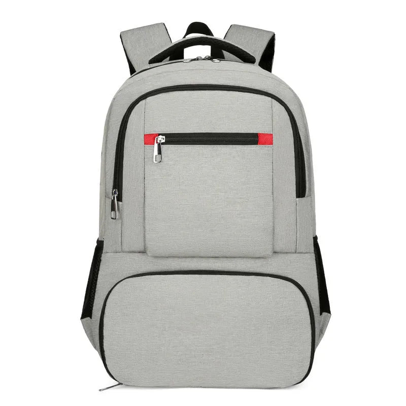Light grey oxford cloth insulated backpack with curved shoulder straps and top handle.