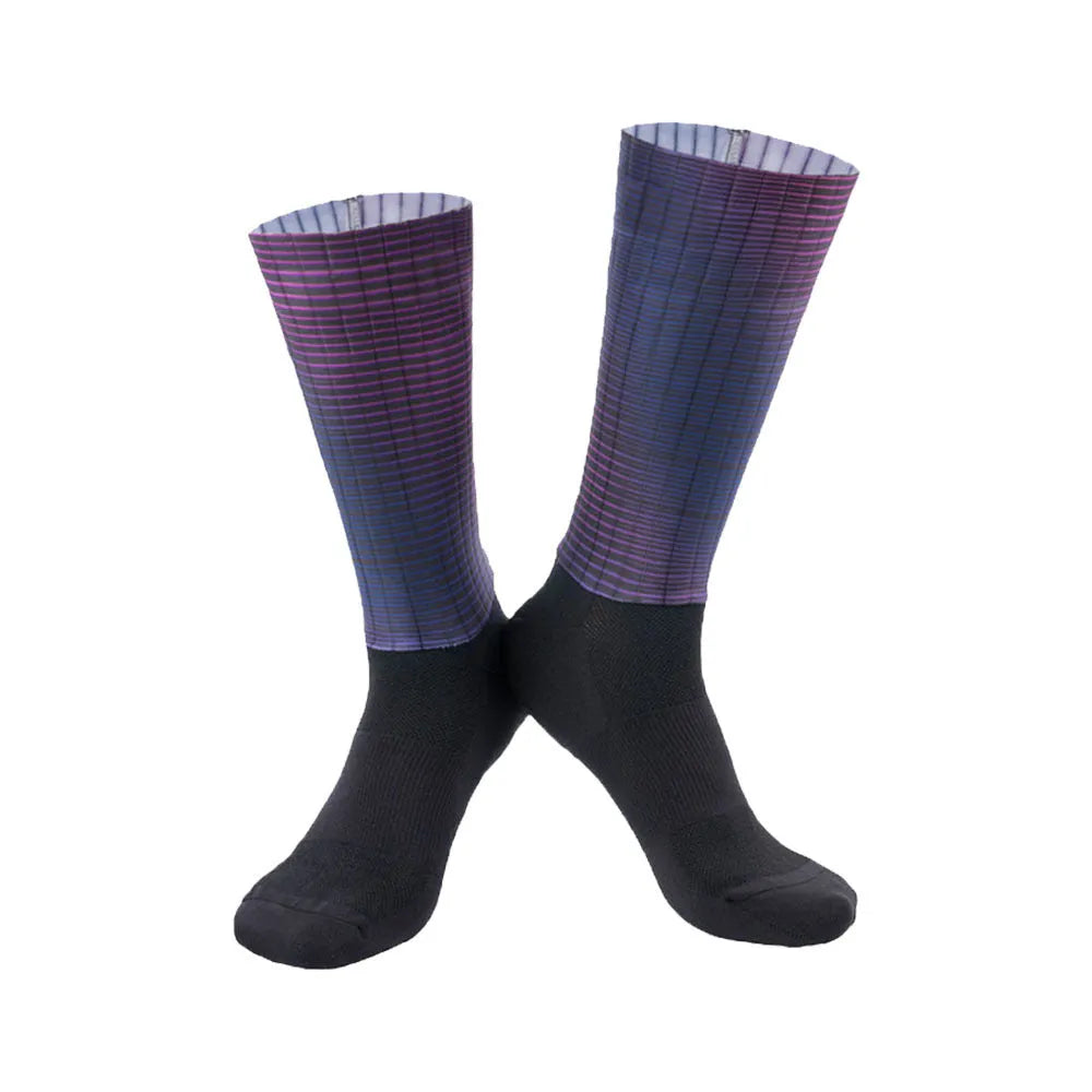 Pair of breathable athletic socks for running and cycling in orange colour on a grey background