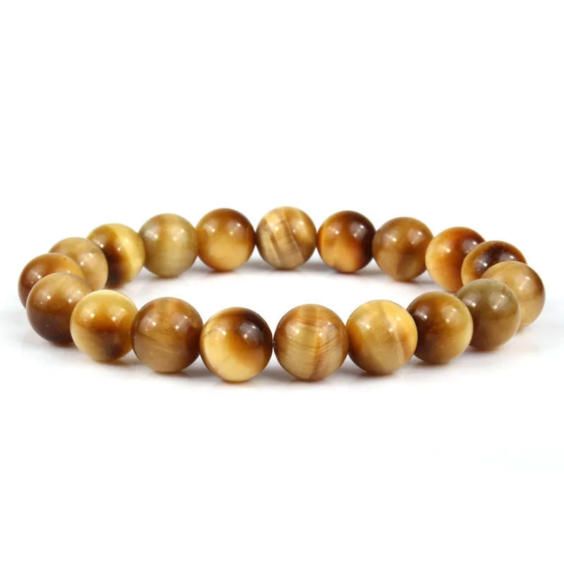 Natural tiger eye crystal beaded bracelet for men and women on a white background.