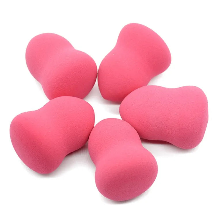 Pink hydrophilic non-latex makeup sponge measuring 4 by 4 by 5.6 centimetres.