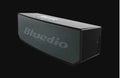 Black rectangular BS-6 cloud smart speaker with Bluetooth connectivity on desktop