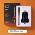Automatic suction pen set with plastic body, stainless steel tip, ink feeder, and handbag on a desk.