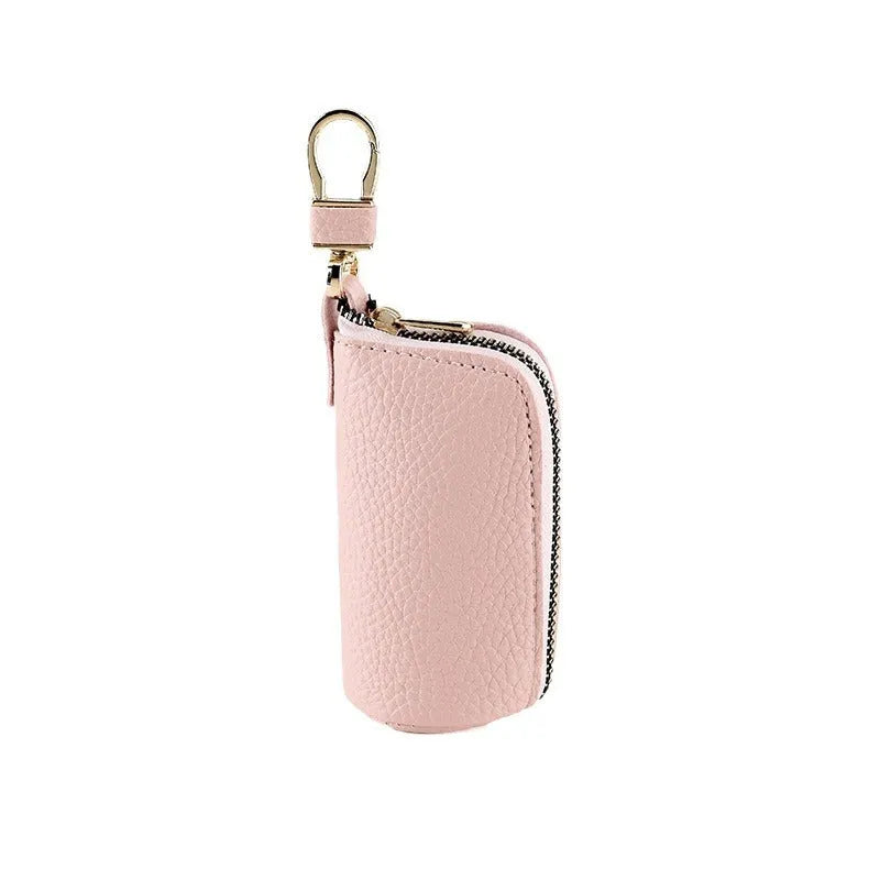 Minimalist black PU leather zippered key case for men, shown closed with a silver zipper.