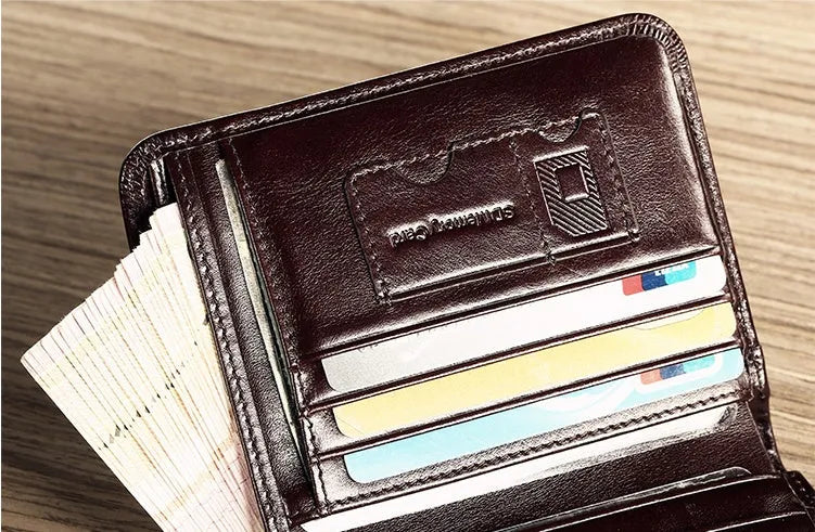 Men's leather wallet showing multiple internal compartments including card slots, coin pocket and photo window