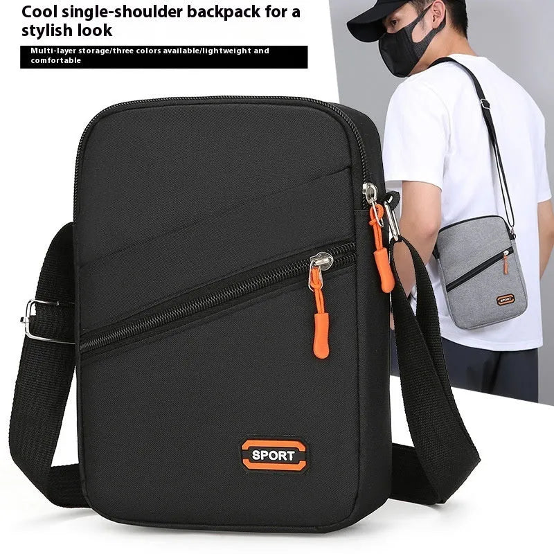Simple solid-colour Oxford cloth crossbody commuter bag in silver grey, black, or navy blue.