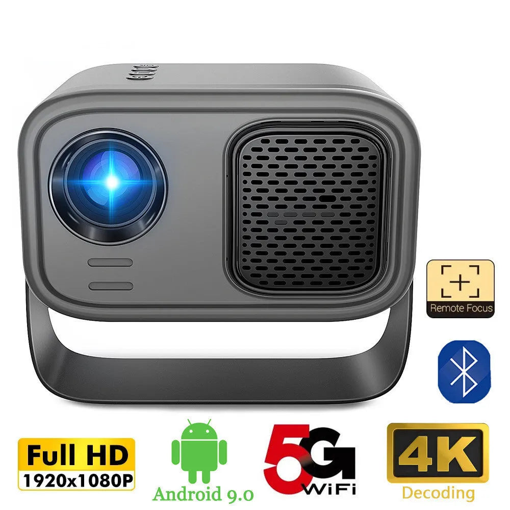 Black HD portable projector with Android system, remote control, and cables on desk