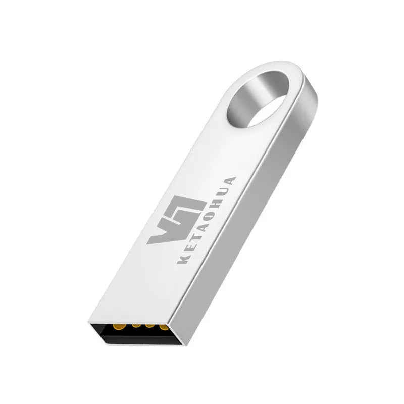 Silver metal car-shaped USB flash drive on a white background, showing USB connector.