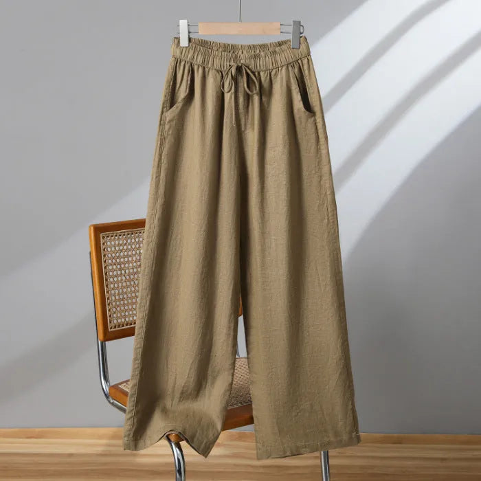 Women's straight-leg casual trousers in apricot colour with elastic and lace-up drawstring waistband.