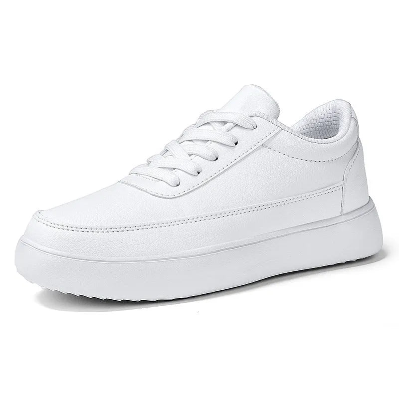 Women's white leather flat casual lace-up shoes on a neutral background.
