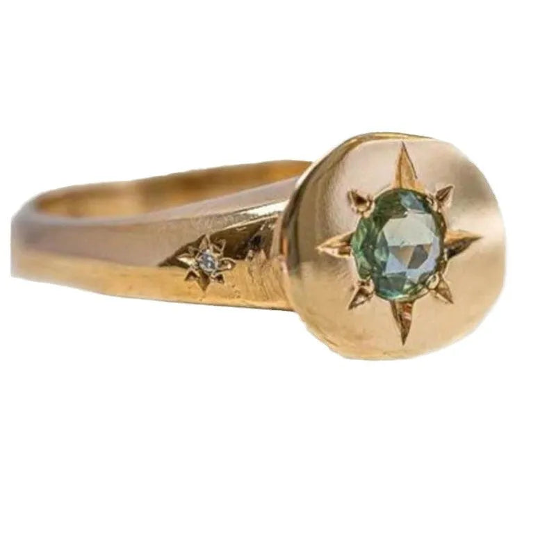 Golden adjustable ring with oval asterism zircon design and star shape