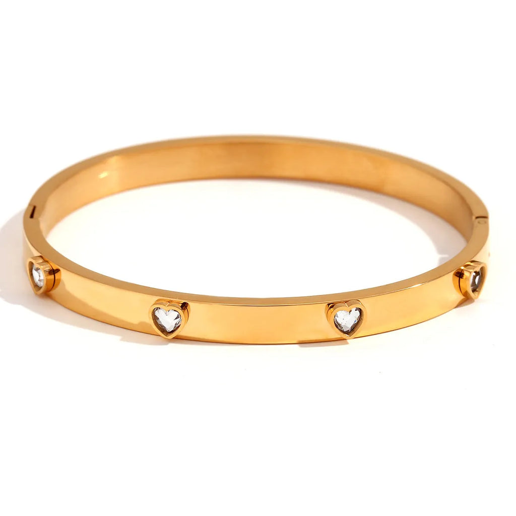 Golden electroplated stainless steel bracelet with micro-inlaid peach heart charm for women