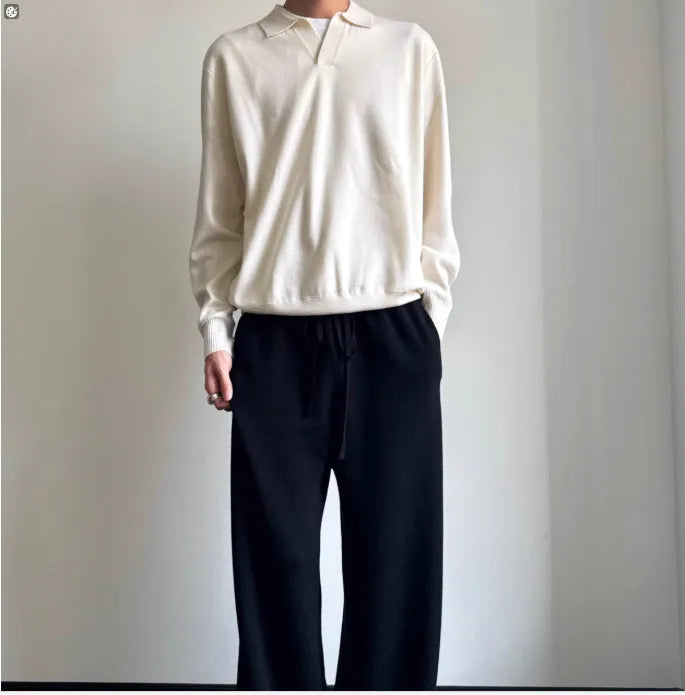 Man wearing a milky white pure wool sweater with a lapel collar and loose fit