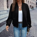 Black women's casual zip-front jacket with long sleeves and faux pockets.