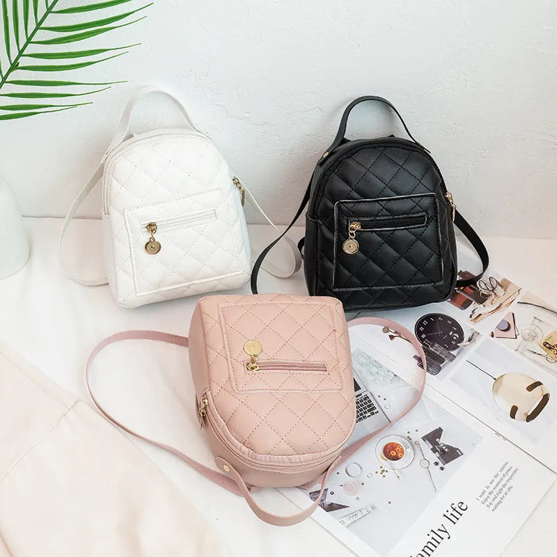 Hard shell square girls backpack with embroidery in black, pink, or white colours.