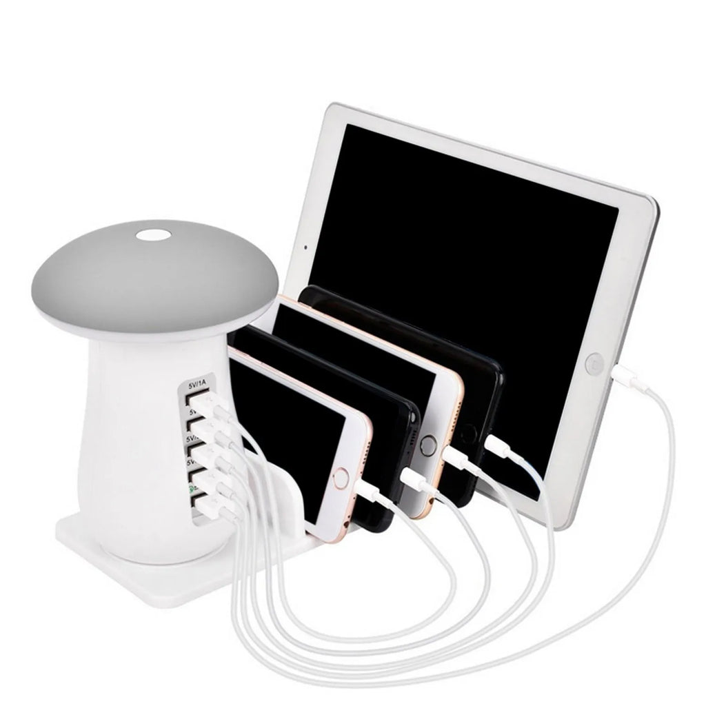 White mushroom-shaped USB charging dock station with five ports and a built-in LED night lamp on a desk.
