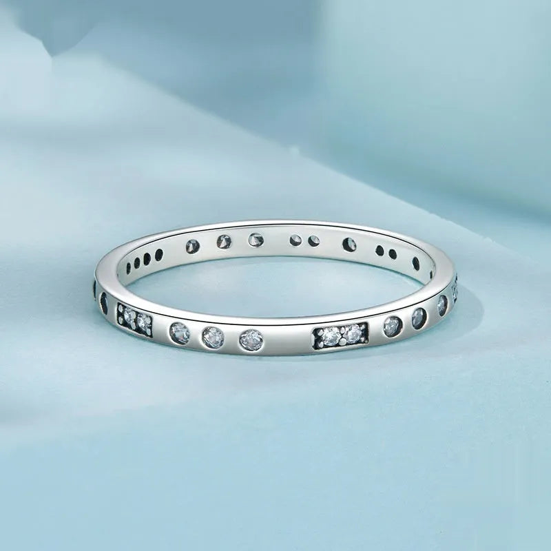 Oxidised black silver 'I Love You' moss password fashion ring on a hand, showing its bracelet-style design.