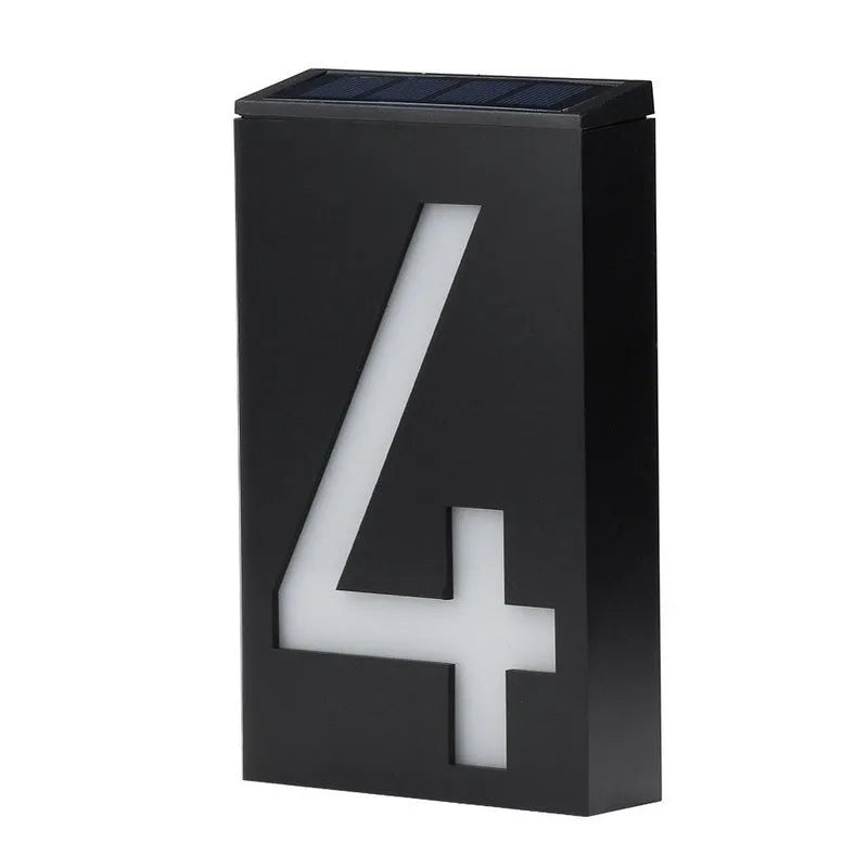 Solar powered house number light with 6 LEDs and IP65 waterproof rating mounted on an exterior wall.