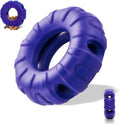 Blue natural rubber dog tyre chew toy with oval openings, shown as a slow feeder and interactive puzzle toy.