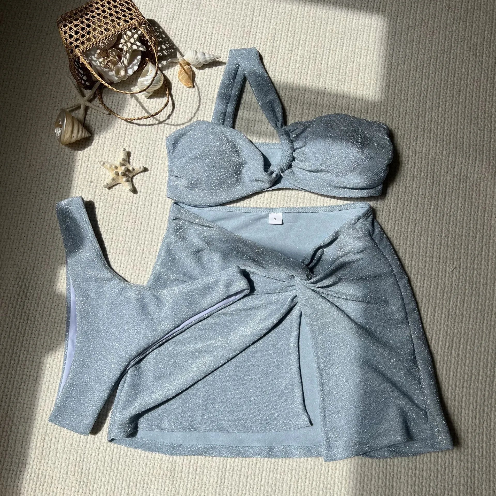 Three-piece one-shoulder swimsuit set in polyester with matching skirt