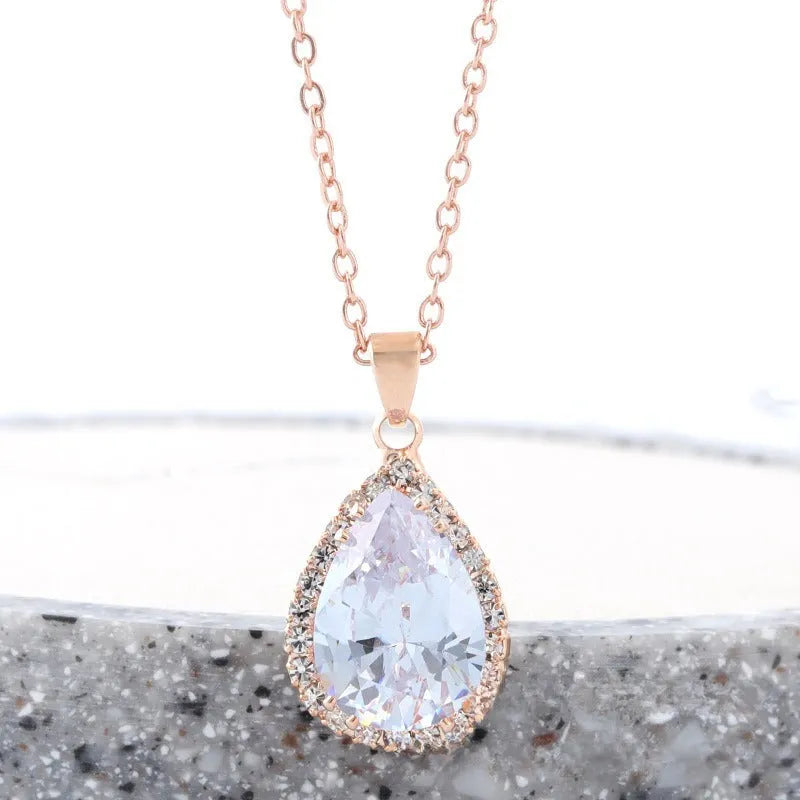 Rose gold pink drop shape women's necklace with geometric rhinestone detailing and alloy construction