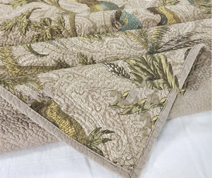 Blue American-style cotton bedspread with floral bird pattern and quilting texture
