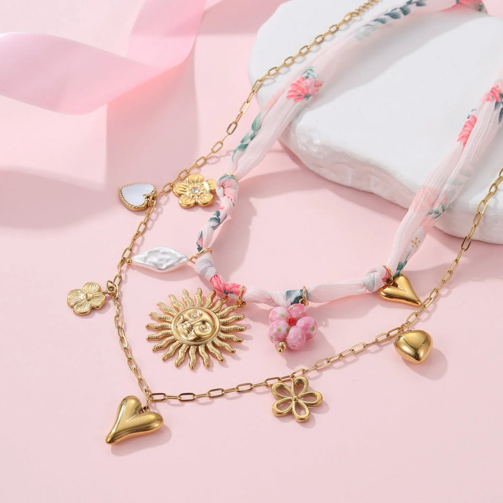 Stainless steel necklace with geometric sun pendant on regular chain, 18K electroplated finish