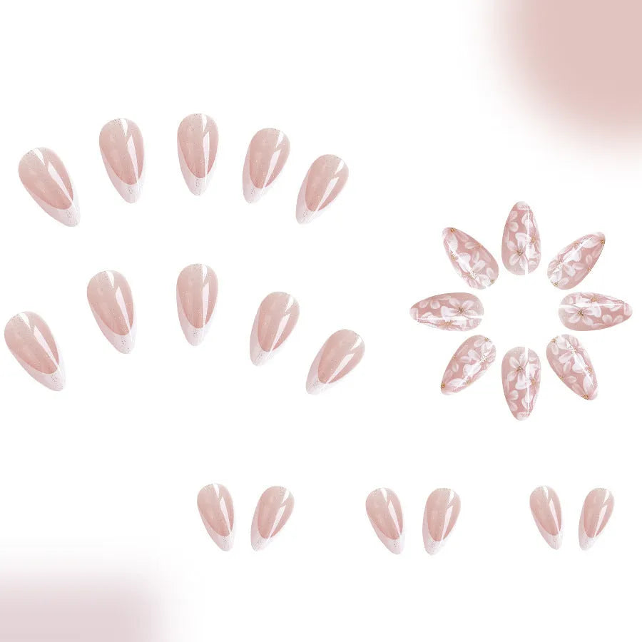 Short almond artificial nails with French style glitter flower decoration in C625 colour