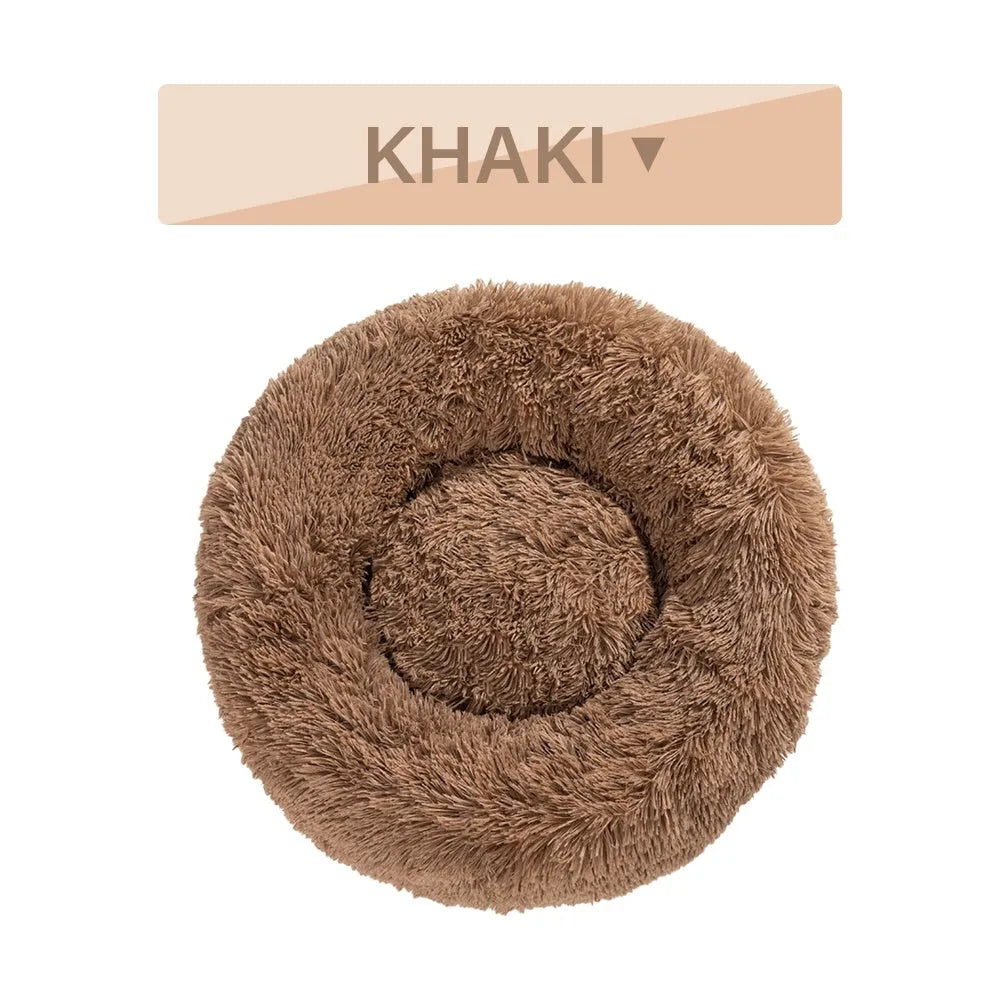 Donut-shaped long plush pet bed with raised sides, shown in a neutral colour.