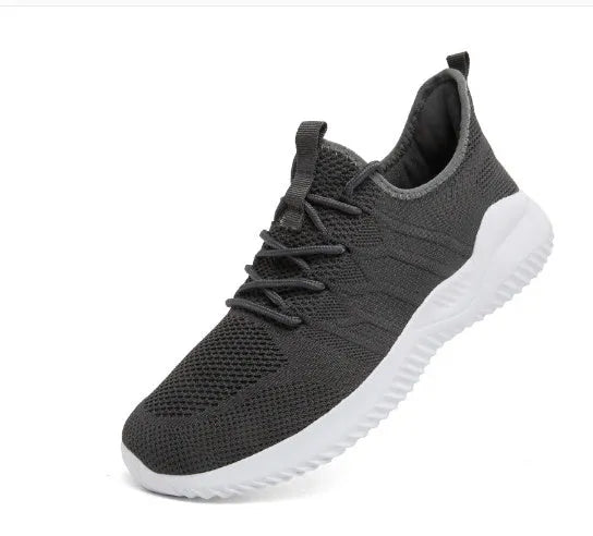 Men's black and white mesh casual sneaker with PVC sole and lace-up closure on a plain background.