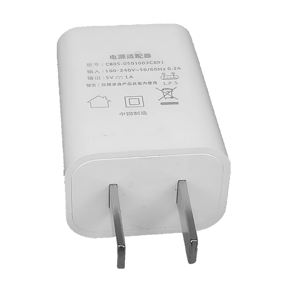 White 5V 1A USB wall charger with CE and FCC marks on a thin housing.