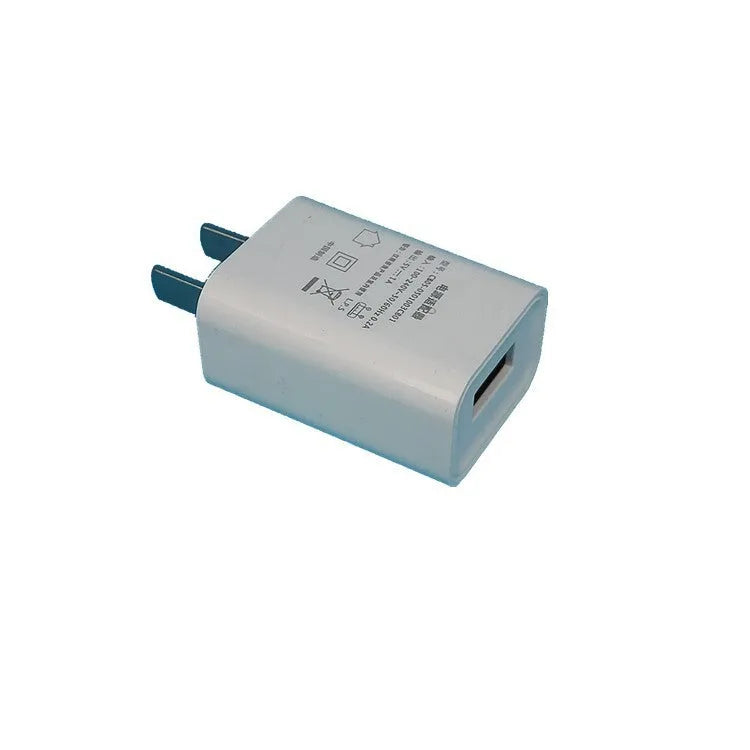 White 5V 1A USB wall charger with CE and FCC marks on a thin housing.