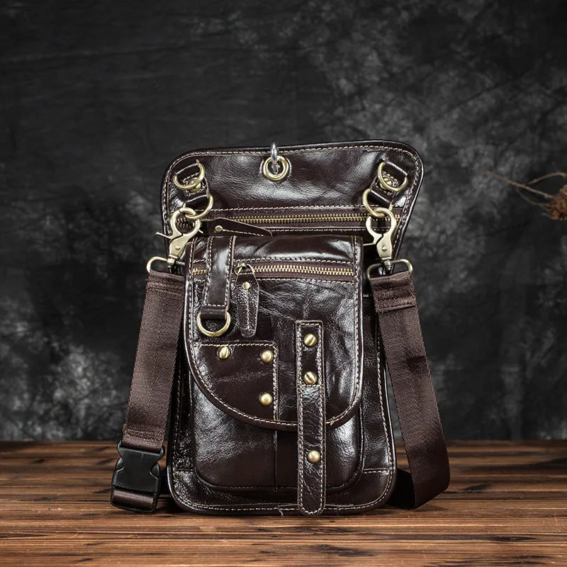 Men's black genuine cowhide leather punk-style fanny pack worn on the waist.