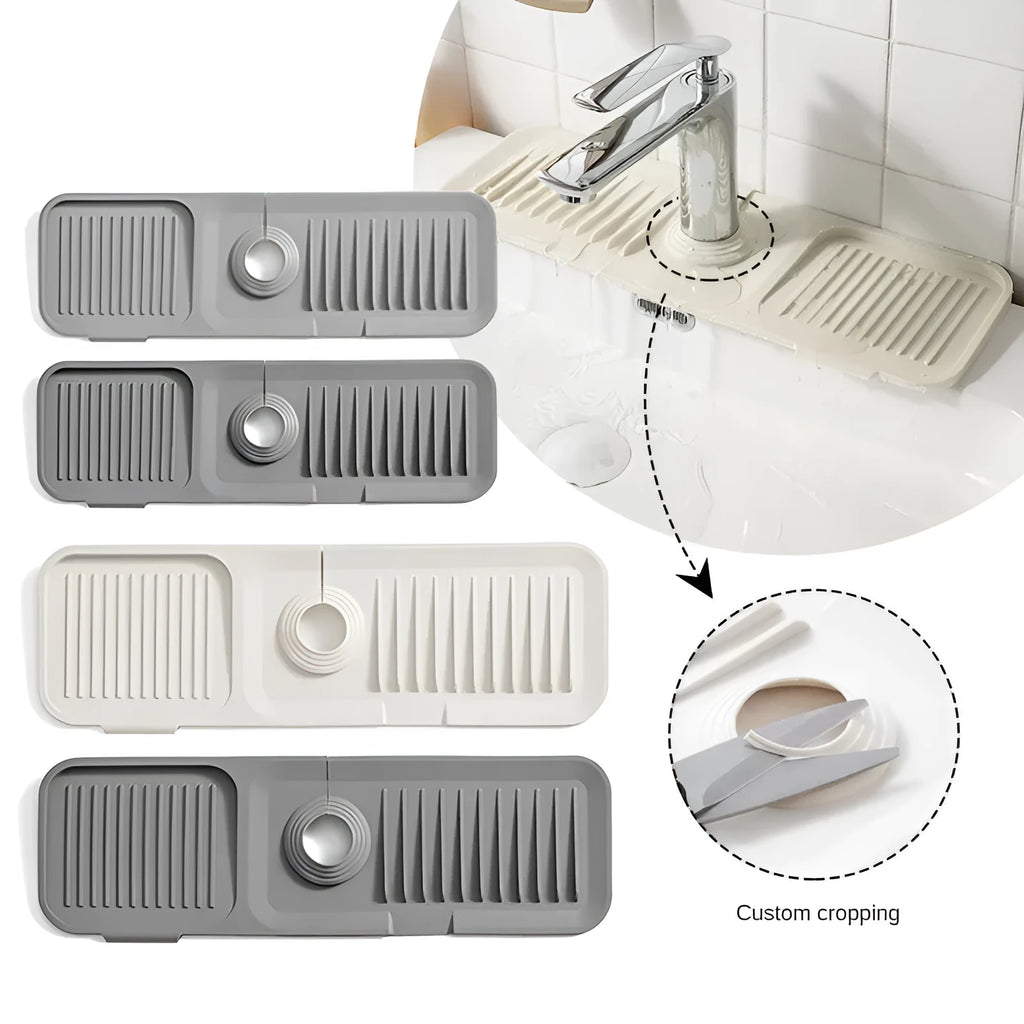 Beige silicone faucet splash guard pad with a sloped design and two circular drain holes, placed under a kitchen tap.