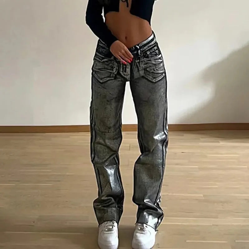 Washed blue high waist straight-leg jeans with contrast colour details on a mannequin.