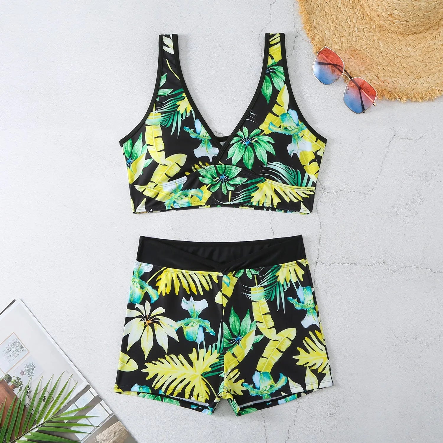 Women's two-piece swimsuit with sleeveless top and printed boxer shorts in multiple colours.