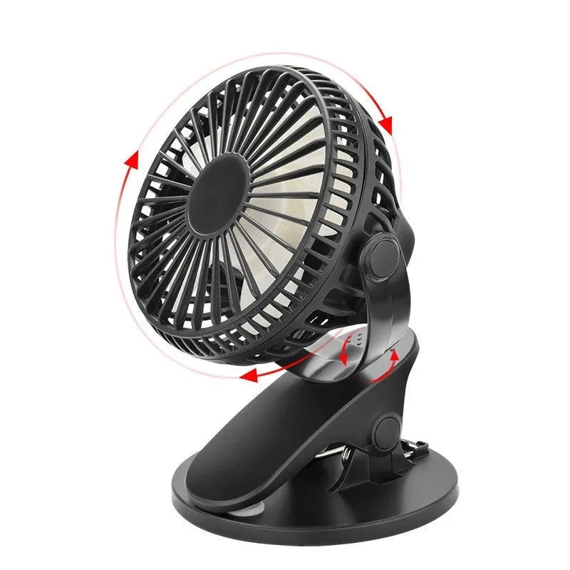 White USB rechargeable clip fan with plastic blades attached to a desk edge.