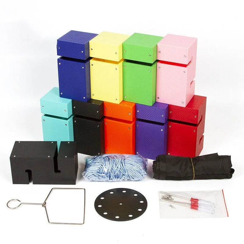 Set of coloured ABS plastic tower blocks with pull ropes and metal hook frame for outdoor team building games.