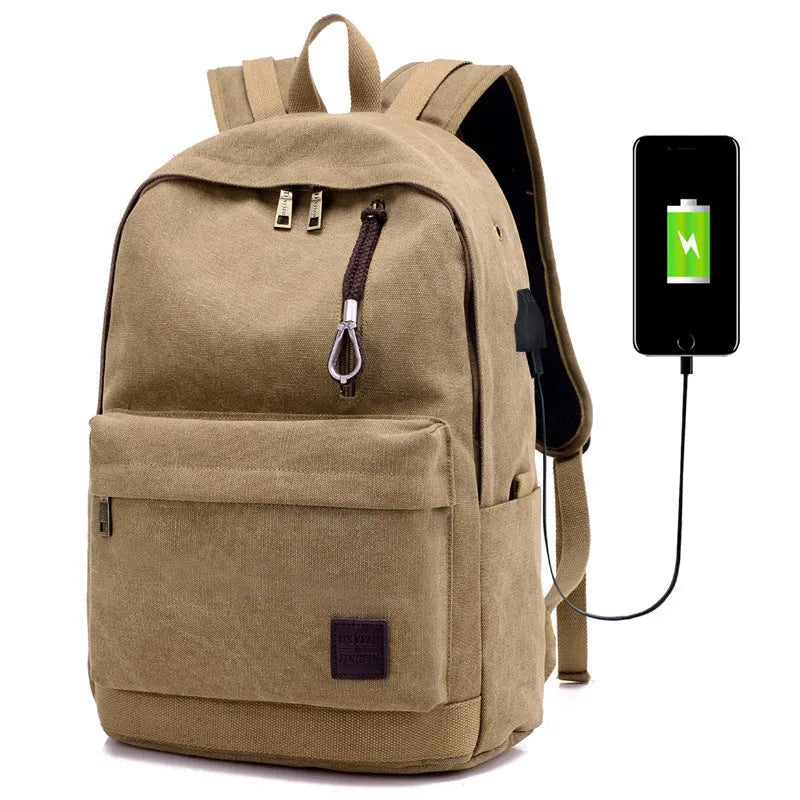 Canvas backpack with USB charging port showing computer compartment and zipper pocket