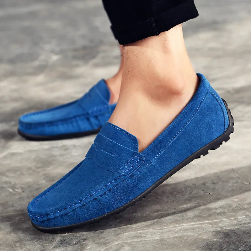 Men's suede leather Gommino casual shoes with flat rubber sole in black colour.