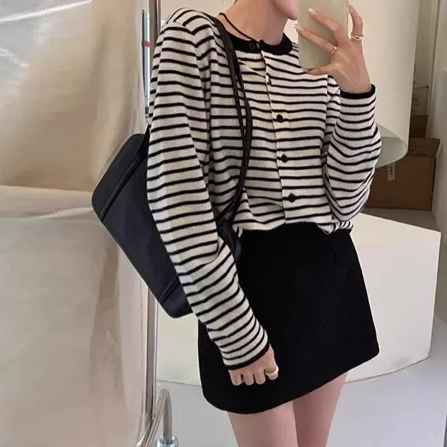 Dark grey and white striped slim fit women's cardigan with long sleeves.