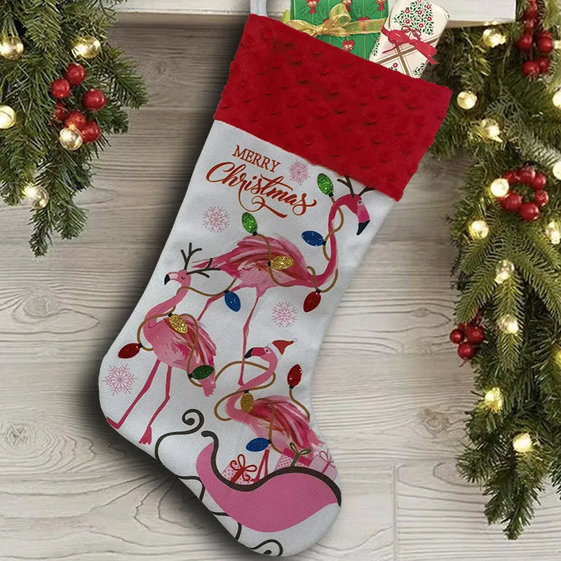 Red and white flamingo print cloth Christmas stocking hanging decoratively.