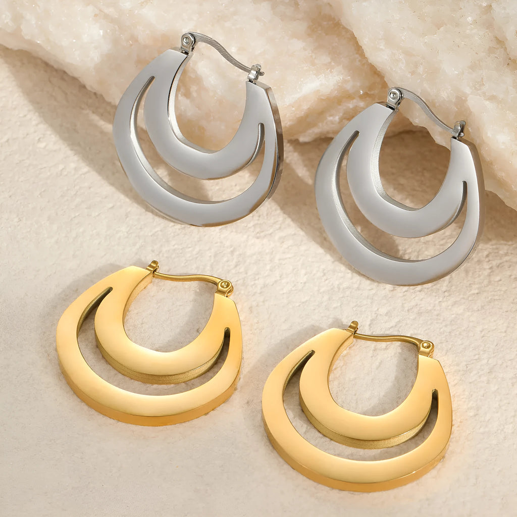A pair of women's geometric French earrings with a round ring design, available in gold or steel colour.