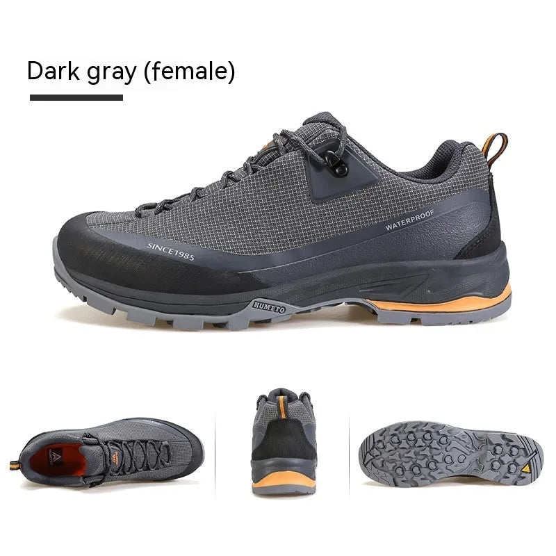 Men's low-top hiking boots in black with a leather mesh upper and rugged rubber outsole.