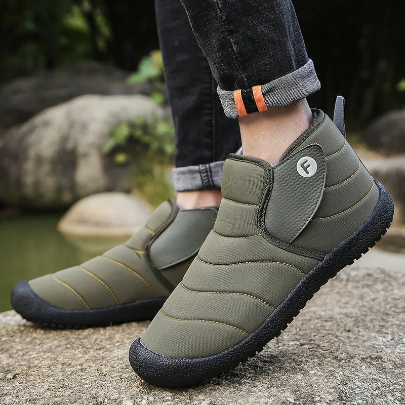 Men's waterproof snow boots in black with a cotton upper and thick rubber sole.