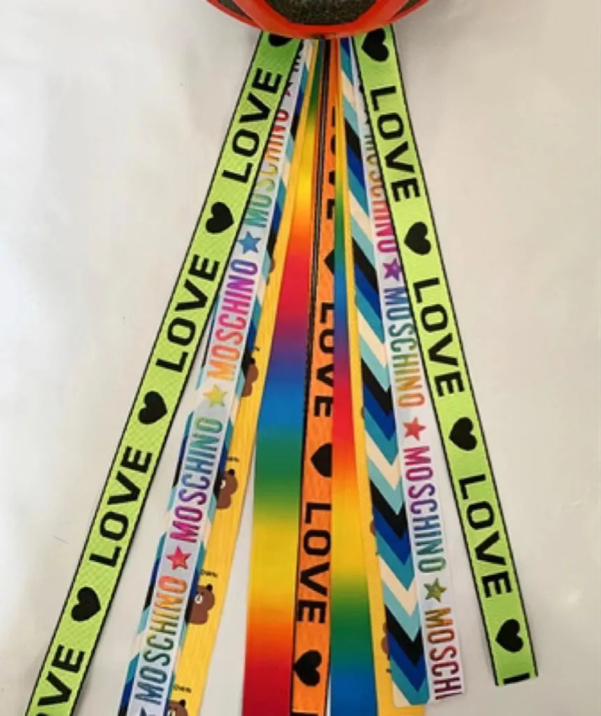Children's decorative helmet streamer ribbon in multiple colours for roller skating and skiing safety gear.
