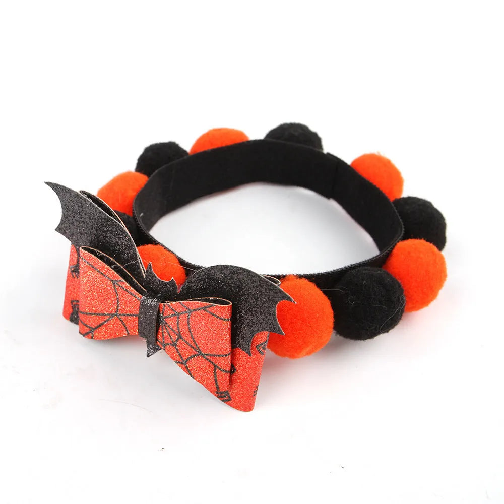 Halloween pet collar with a fur ball decoration in a pumpkin design, shown in size M