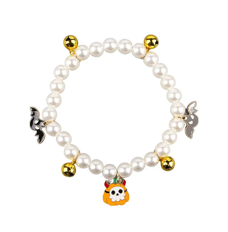 Purple simulated pearl Halloween cat collar decoration with a choice of ghost or pumpkin pendants.
