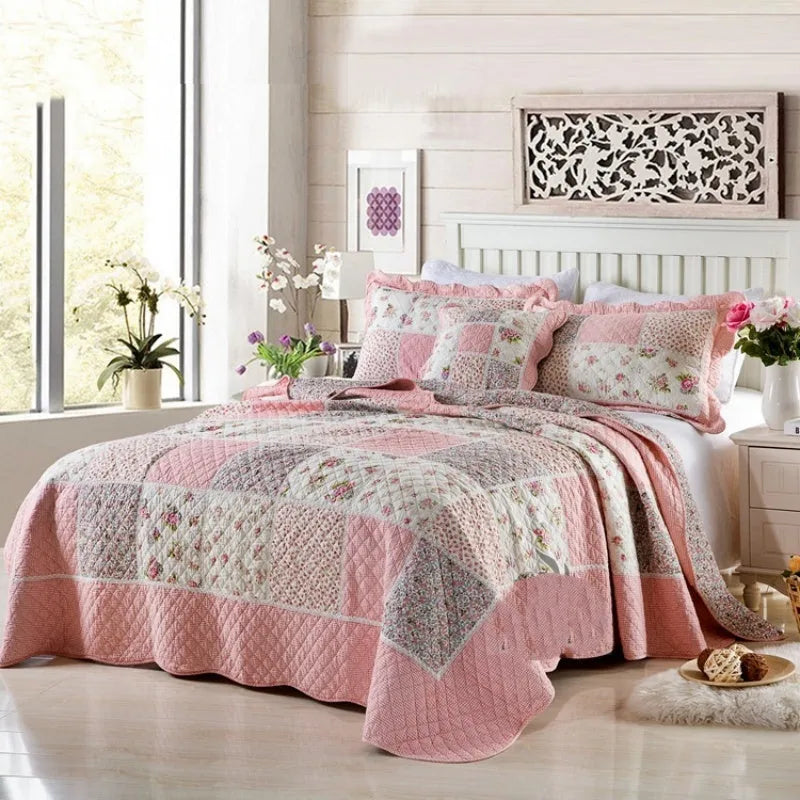 Washed pure cotton quilted bedspread set with one large cover and two pillowcases on a bed.